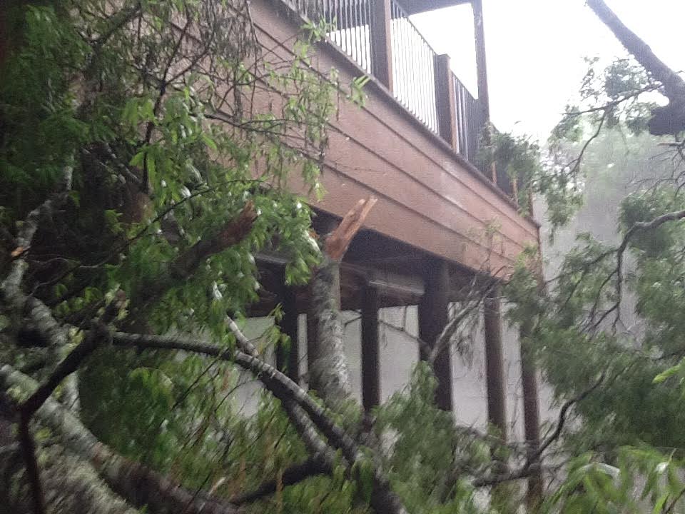 Storm damage — tree through deck